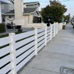 White Vinyl Ranch Rail Fencing fro the front porch